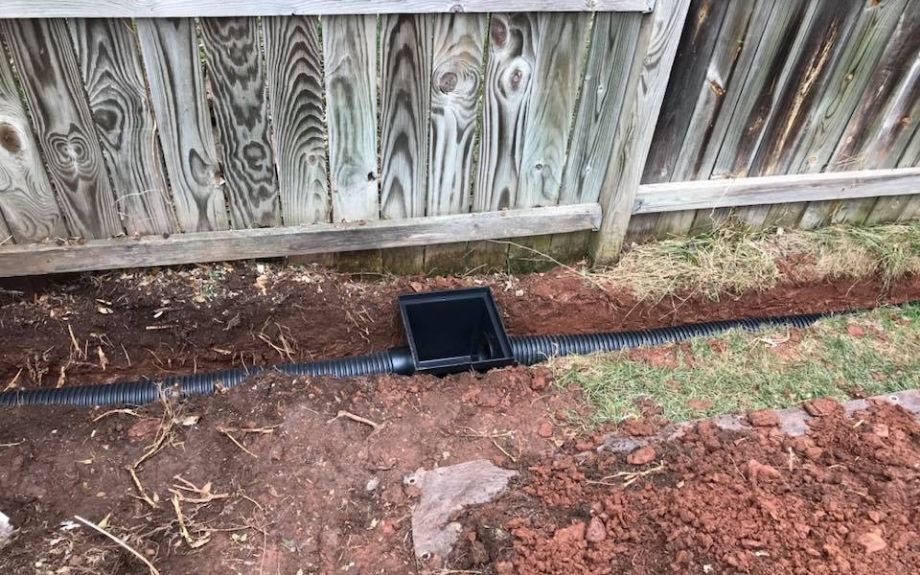 A french drain installed in a Riverbend client's yard.