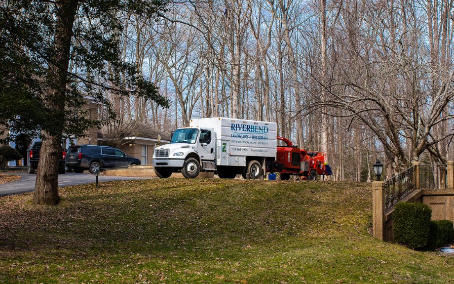Riverbend vehicles and tree care equipment on a Northern Virginia residential street during the winter months.